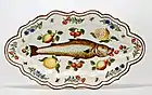 Polychrome maiolica dish with paintings of a fish, flowers and fruit, Lodi, 1751.