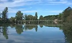 Wooden bridge on the Krka River at Loke