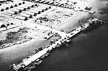 An aerial view of a dock with a nearby base