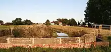 small brick parapet bridge over the stream