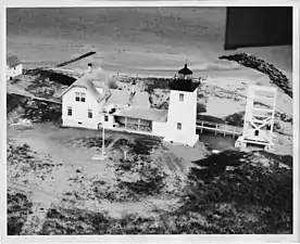 The second light, built 1875 (still in use) and keeper's house (since removed)