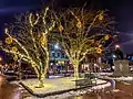 Longfellow Square illuminated for the 2018 holiday season. Longfellow Monument is at right.