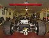 View of Lotus 49B showing high rear wing fixed directly to suspension