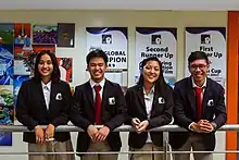 Students from the MIIS Upper School wearing the MIIS uniform.