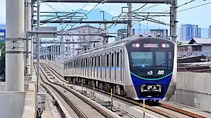 Ratangga (with Jak Lingko livery) set 11 departing from Lebak Bulus station