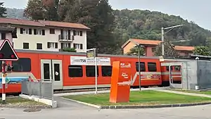 Red train at low-leve platform