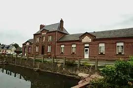 The town hall and school in Fresnoy-Folny