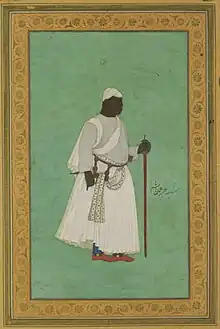 17th-century painting of a man in ceremonial dress with a staff, against a green background