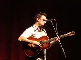 Erelli performing at the Woody Guthrie Folk Festival in July 2009.