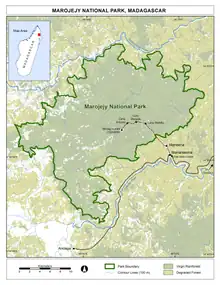 Map of showing contour lines, forest cover in two shades (virgin vs. degraded), the trail from the visitor center, and the road and nearby towns.