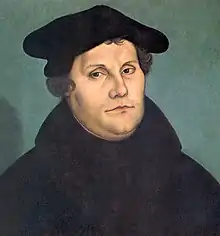 A painting of Christian Reformer Martin Luther, wearing a black hat and high-necked black clothing.