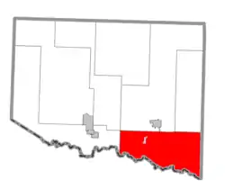 Location within Iron County (red) and the administered village of Alpha (pink)