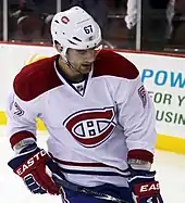 Waist high portrait of hockey player in uniform