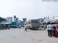 Buses and cars on a busy street