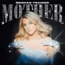 A blonde woman, spotlit, posing for a picture. The text "Meghan Trainor Mother" stands above her.