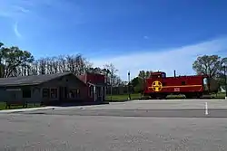 Avoca Mercantile and an Atchison, Topeka and Santa Fe Railway caboose in Avoca