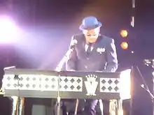 Barson performing live with Madness at Manchester Arena in 2014