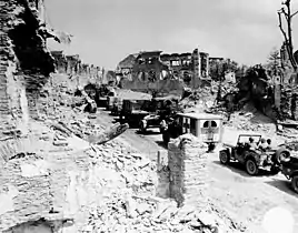 WC-54 in a convoy through devastated Saint Lo.