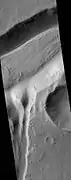 Minio Vallis Hanging Valleys, as seen by HiRISE.  Two hanging valleys are visible, as well as many dark slope streaks.