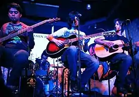 Mizraab performing live at V-Sel Outlet, Karachi, in 2011. Visible from left to right are; Ferdinand Goveas, Irfan Ahmed (back), Faraz Anwar and Muhammad Muzzamil.