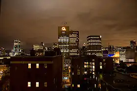 Montreal skyline at night with the Hydro-Québec Building in the center.