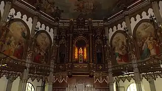 Statue of the Holy Infant of Prague enshrined in the cedar wood retablo