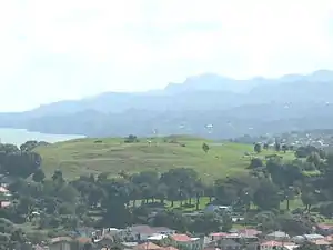 Mount Roskill from Big King. The Waitākere Ranges in the background.