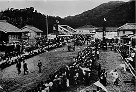 Historic photo taken on the day the station was opened. Note the station building in the background. There was, at the time, a footbridge linking to the platforms.