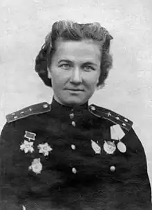 Photo of woman in decorated military uniform