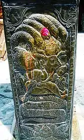 Naga on copper pillar in Kullu, Himachal Pradesh India