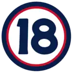 The number "18" in navy blue set against a white circle with a red and navy border