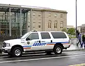 Nassau County Corrections Ford Excursion striped orange & blue.