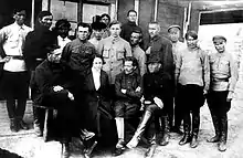 Photograph of Halyna Kuzmenko, Nestor Makhno and fifteen of their supporters in a Polish internment camp