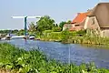 Farms in Spengen, with drawbridge over the Geer canal.