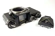 A Nikon F body with detached pentaprism viewfinder, showing the focusing screen