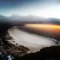 An evening flight over Noordhoek Beach, with Kommetjie in the distance.