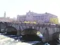 Northern part of Norrbro in front of the Riksdag building viewed from Gustaf Adolfs torg, below Lake Mälaren is gushing into the Baltic Sea.