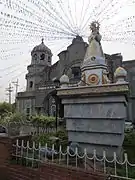 Nuestra Señora de los Desamparados in front of the OLA Church