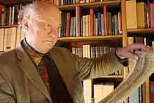 Prof. Nigel F. Palmer, Emeritus Professor of German Medieval and Linguistic Studies, preparing for a lecture series on Easter Plays in Azerbaijan 2015 by examining the facsimile scroll of the Osterspiel von Muri in the Taylor Institution Library, University of Oxford