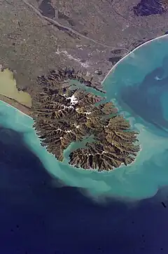 Lyttelton Harbour (right / northwest) and  Akaroa Harbour (left / south) in the Banks Peninsula Volcano, viewed in 2006 from the International Space Station