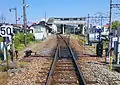 View of the station from the south before the removal of the platform 1 track on the left, with the Tōbu Ogose Line platforms on the right, April 2011