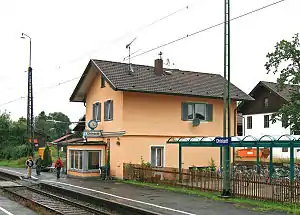 Two-story building with gabled roof