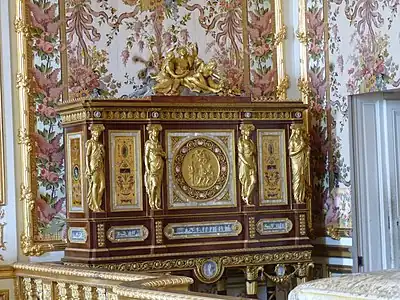 Louis XVI style caryatids with Ionic capitals on their heads, on a jewelry locket of Marie-Antoinette, by Ferdinand Schwerdfeger, 1787, mahogany, mother-of-pearl inlays, paintings under glass, porcelain plate, and gilded bronzes, Chambre de la Reine, Palace of Versailles, Versailles, France