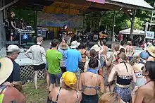 Talisk performing in an outdoor bandshell