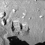 The first two trenches dug by Phoenix in Martian soil. The trench on the right, informally called "Baby Bear", is the source of the first samples delivered to the onboard TEGA and the optical microscope for analysis.