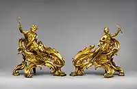 Pair of French Rococo andirons; circa 1750; gilt bronze; dimensions of the first: 52.7 × 48.3 × 26.7 cm, of the second: 45.1 × 49.1 × 24.8 cm; Metropolitan Museum of Art (New York City)