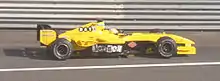 Giorgio Pantano driving the Jordan EJ14 at the 2004 French Grand Prix. You can see the lack of sponsorship on the sidepods, which instead has a Jordan logo.