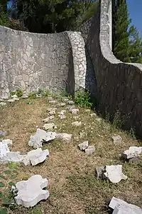 Abandoned terrace with devastated tombstones