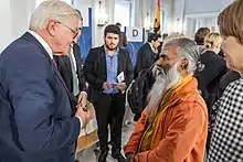 Paskaran talking with the federal president Steinmeier.