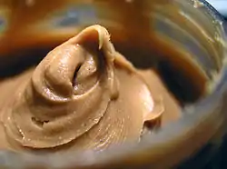 An open jar of peanut butter